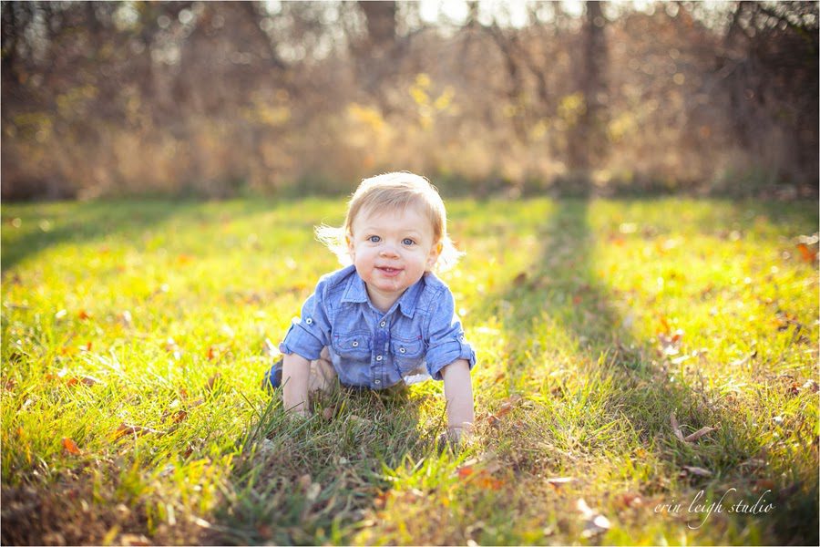 one year old crawling in grass photos