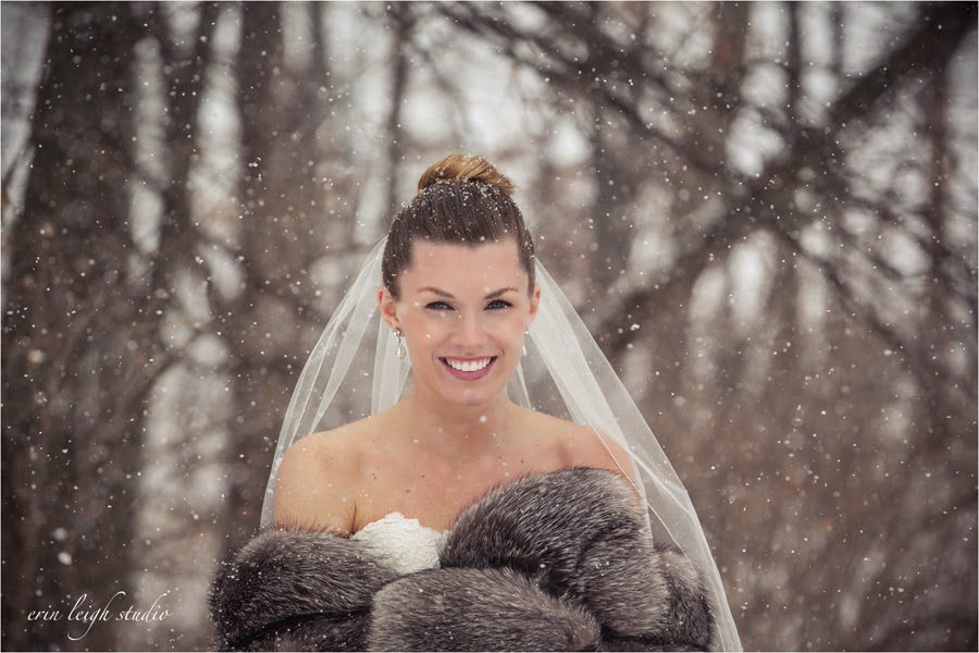 bride with fur jacket in snow