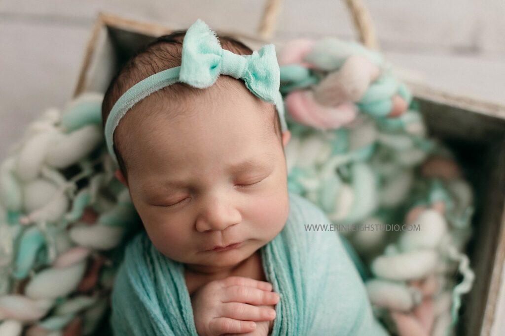 Pretty baby girl in mint and pink newborn photos