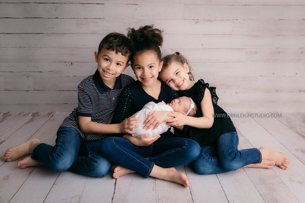 Newborn baby with siblings